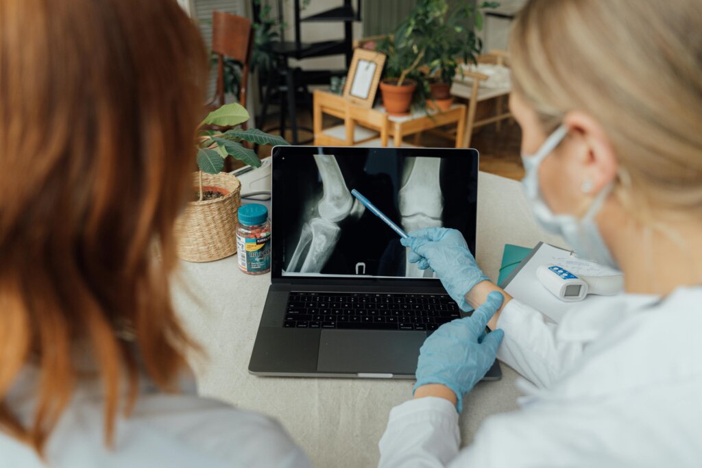 Interventional radiologist performing a minimally invasive, image-guided biopsy procedure